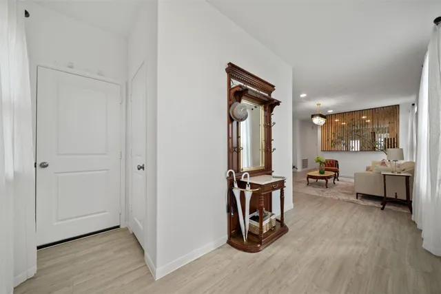 a view of a livingroom with furniture and a flat screen tv