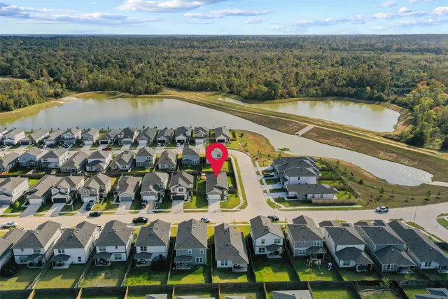 an aerial view of residential houses with outdoor space