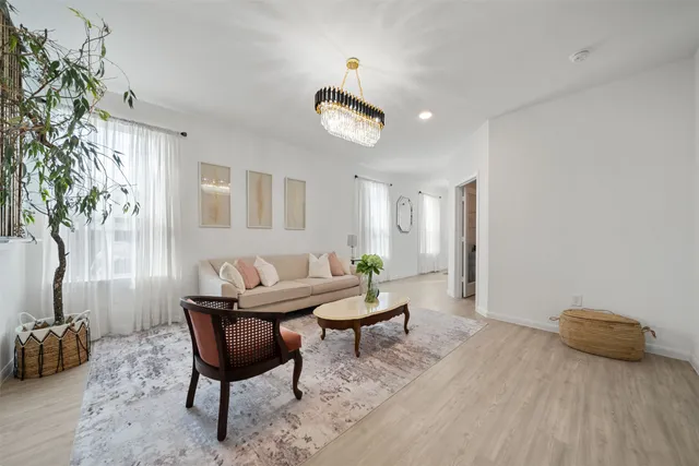 a view of a livingroom with furniture and a potted plant