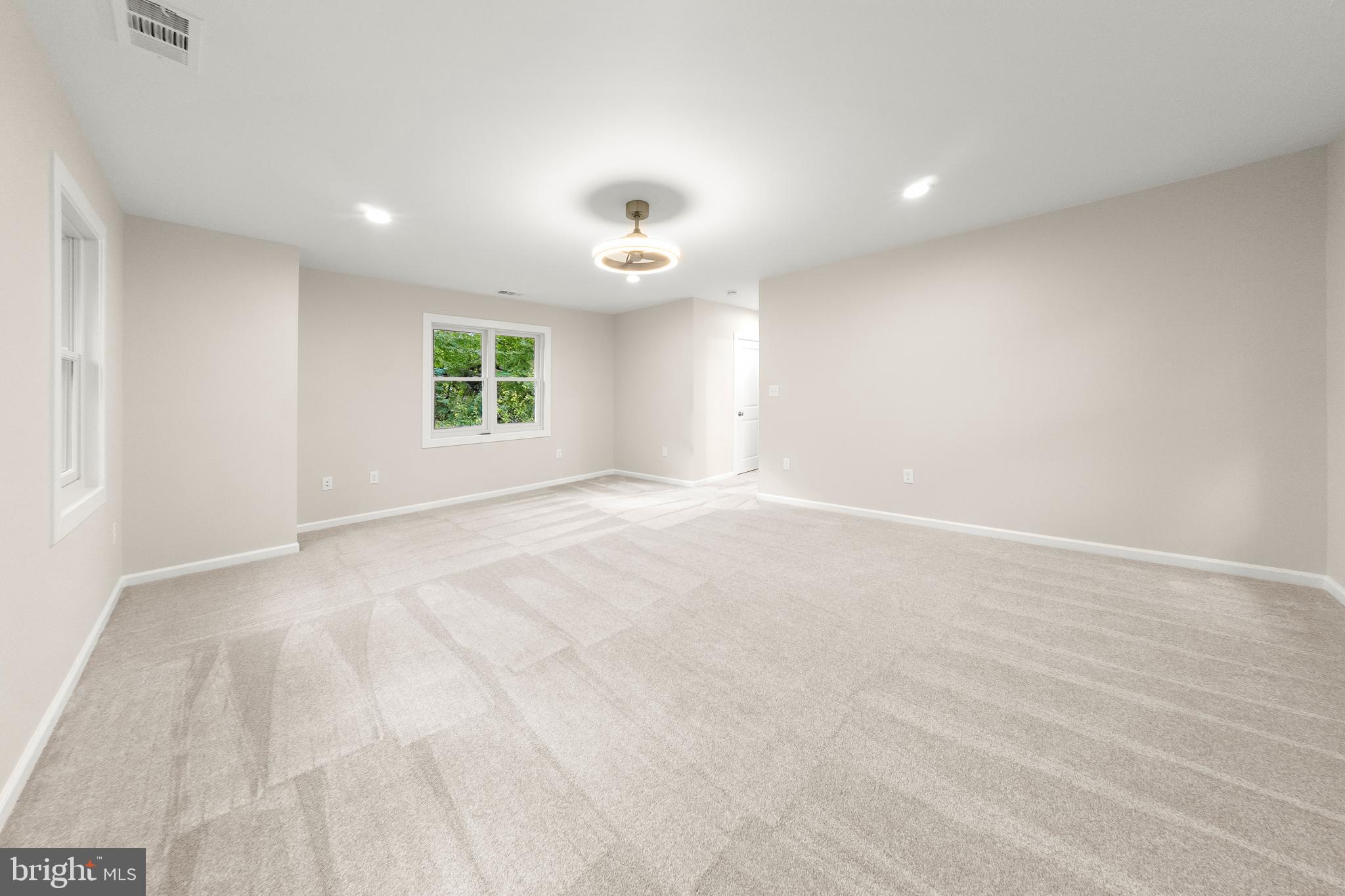 10220 Capitol View Avenue Silver Spring, MD 20910 - Photo 41 of 62 Primary bedroom with ceiling fan and warm carpetin