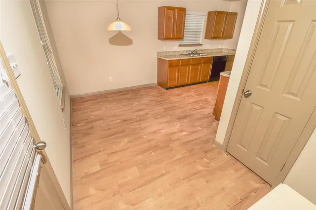 a view of front door with washer and dryer