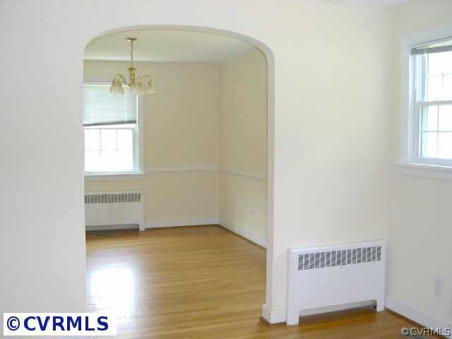 6402 Club Road Richmond, VA 23228 - Photo 6 of 8 Other - Dining room w/chair railing, chandelier & arched opening from the living room