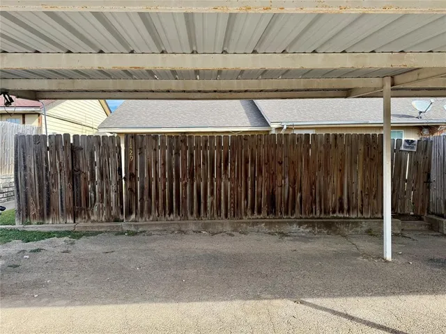 a view of outdoor space and wooden fence