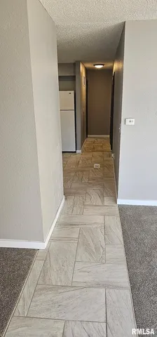a kitchen with kitchen island granite countertop a sink and steel appliances