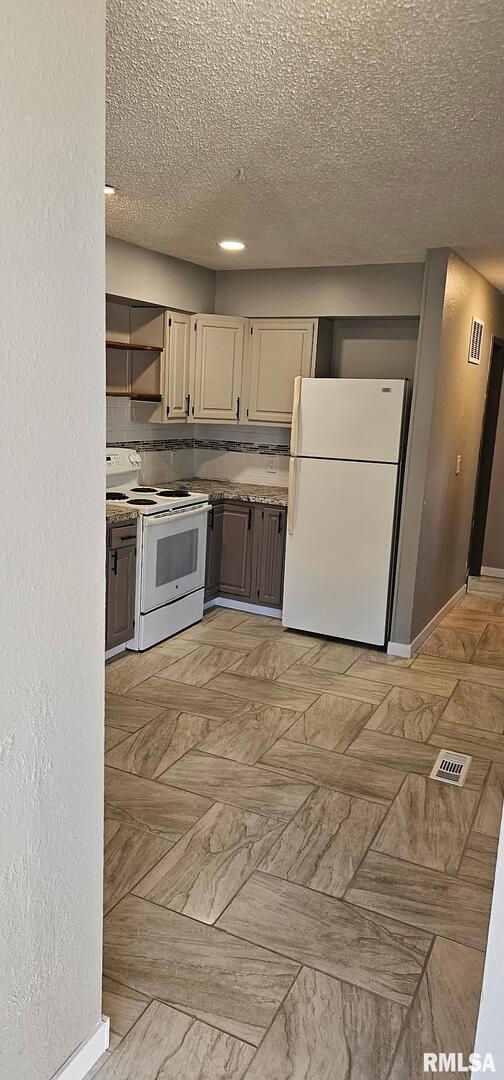 2515 North 3rd Street Clinton, IA 52732 - Photo 17 of 21 a kitchen with kitchen island granite countertop a sink and steel appliances