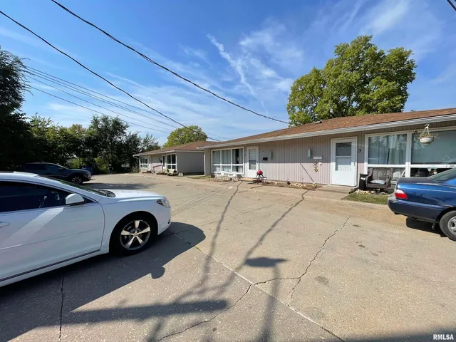a view of a car parked in front of a house