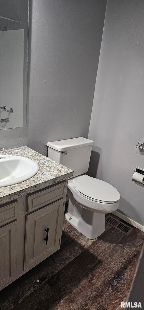 2515 North 3rd Street Clinton, IA 52732 - Photo 10 of 21 a white toilet sitting next to a bathroom sink