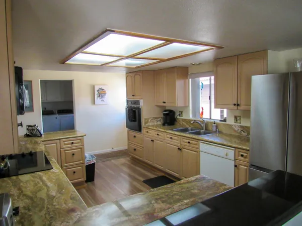 a kitchen with a sink stove and refrigerator