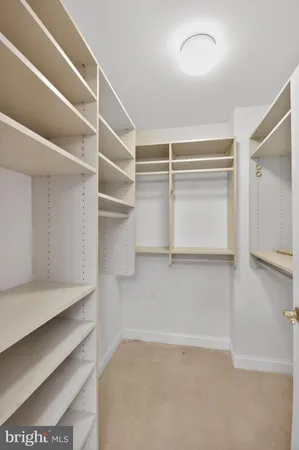a view of an empty walk in closet