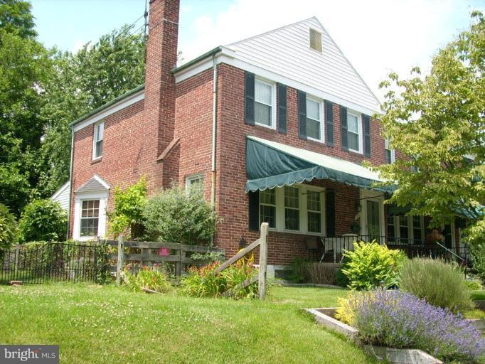1741 Glen Ridge Road Parkville, MD 21286 - Photo 2 of 30 a front view of a house with a yard and potted plants