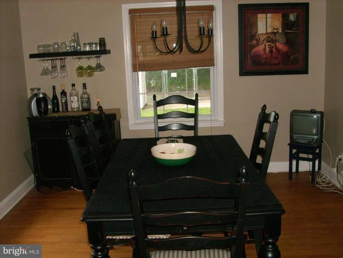 1741 Glen Ridge Road Parkville, MD 21286 - Photo 11 of 30 a view of a dining room with furniture and wooden floor