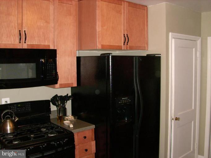 1741 Glen Ridge Road Parkville, MD 21286 - Photo 14 of 30 a kitchen with stainless steel appliances a stove and a microwave