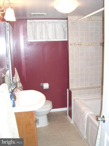 1741 Glen Ridge Road Parkville, MD 21286 - Photo 17 of 30 a bathroom with a sink a toilet and shower