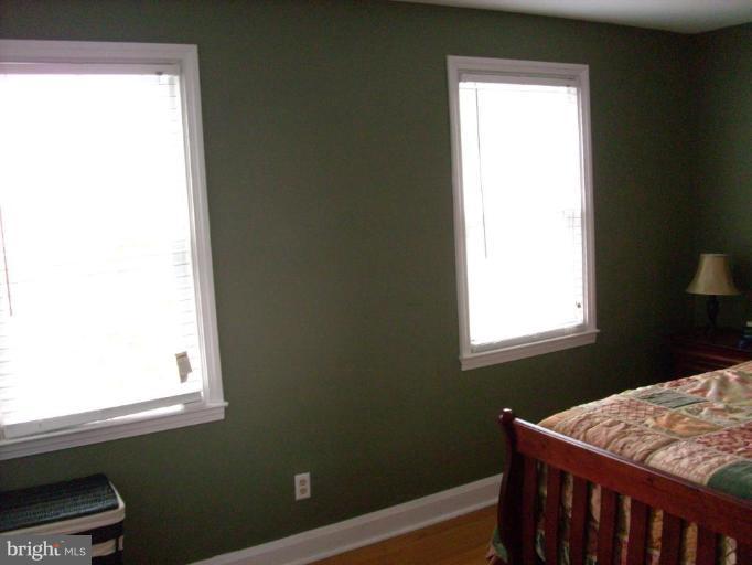 1741 Glen Ridge Road Parkville, MD 21286 - Photo 22 of 30 a bedroom with a bed window and wall painting
