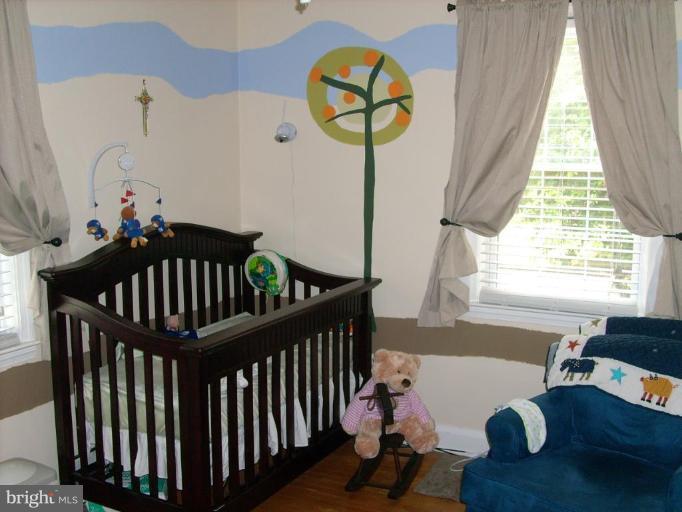 1741 Glen Ridge Road Parkville, MD 21286 - Photo 23 of 30 a bedroom with furniture and a window