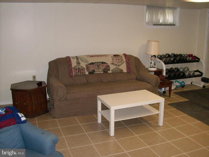 1741 Glen Ridge Road Parkville, MD 21286 - Photo 26 of 30 a living room with a couch