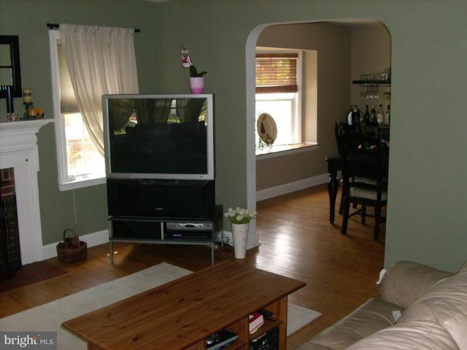1741 Glen Ridge Road Parkville, MD 21286 - Photo 8 of 30 a living room with table chairs and a window