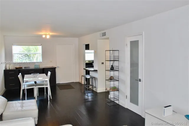 a view of a livingroom with furniture and wooden floor