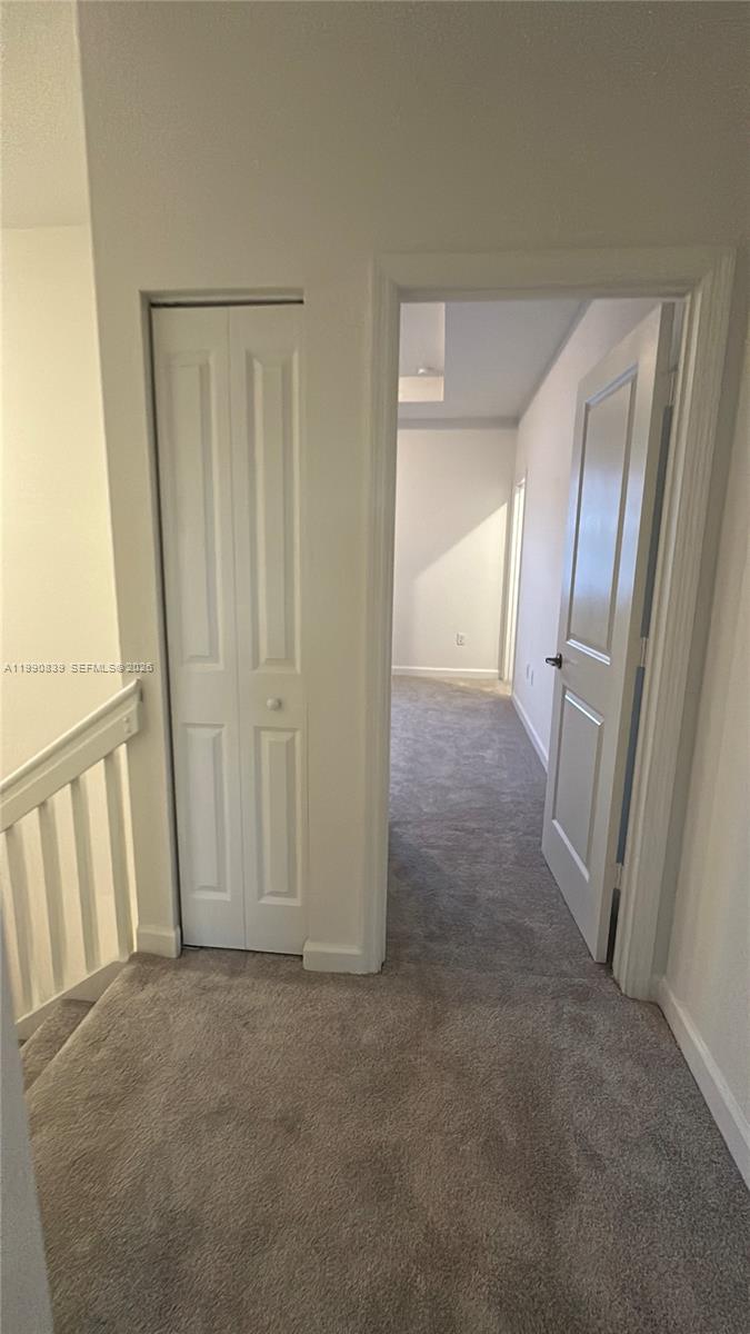 2889 Southeast 25rd, Unit 2889 Homestead, FL 33035 - Photo 19 of 23 an empty room with a mirror