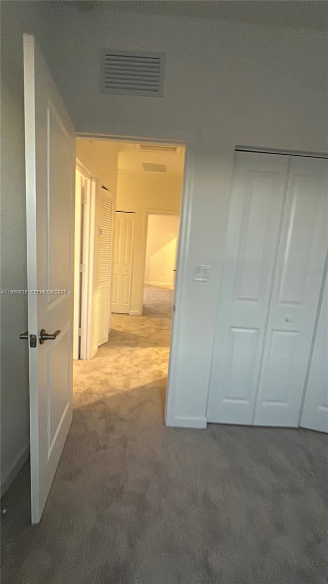 2889 Southeast 25rd, Unit 2889 Homestead, FL 33035 - Photo 21 of 23 a view of an empty room and a window