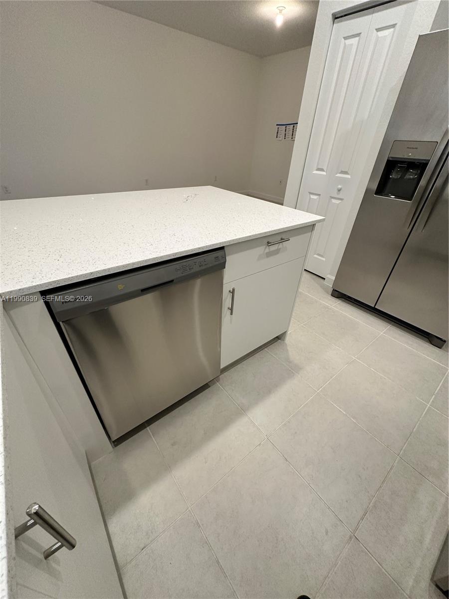 2889 Southeast 25rd, Unit 2889 Homestead, FL 33035 - Photo 5 of 23 a utility room with washer and dryer
