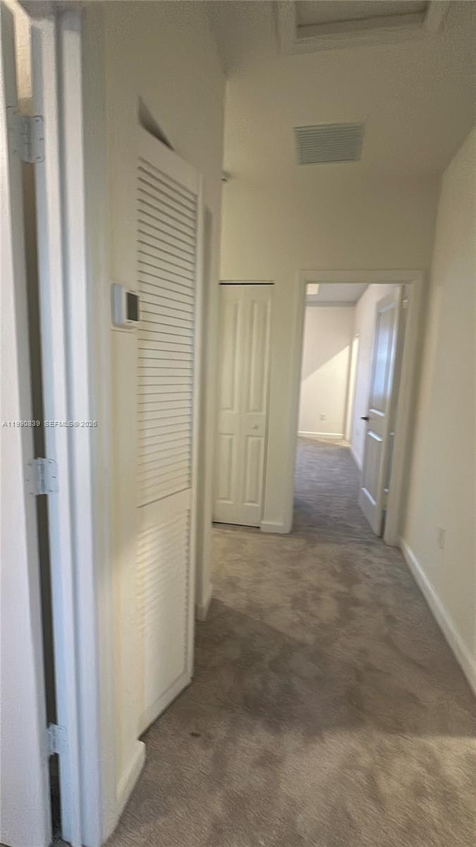 2889 Southeast 25rd, Unit 2889 Homestead, FL 33035 - Photo 10 of 23 an empty room with windows and closet