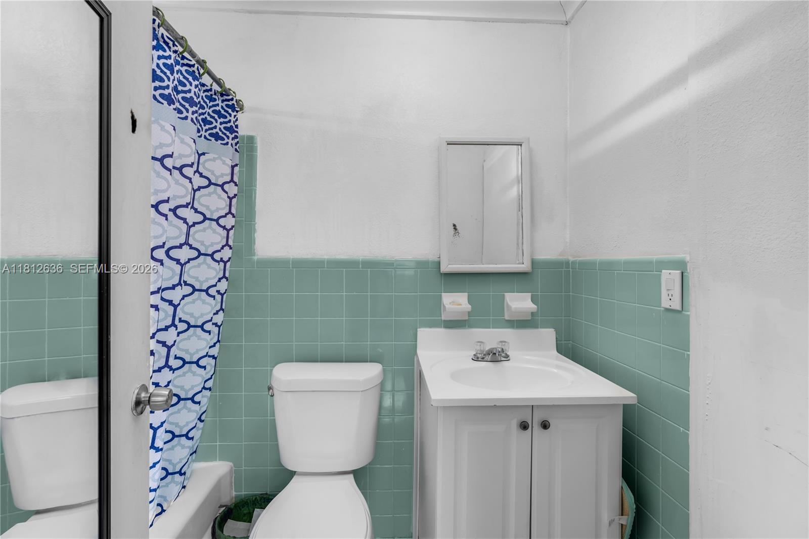 18820 Southwest 316th Street Homestead, FL 33030 - Photo 11 of 43 a bathroom with a sink a toilet and a mirror