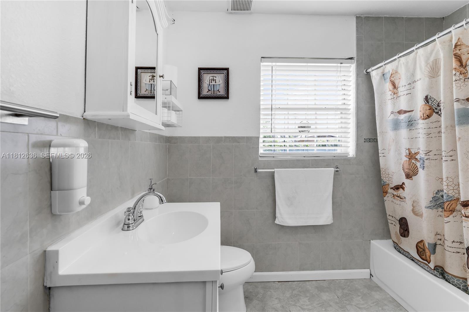 18820 Southwest 316th Street Homestead, FL 33030 - Photo 15 of 43 a bathroom with a sink and a bathtub