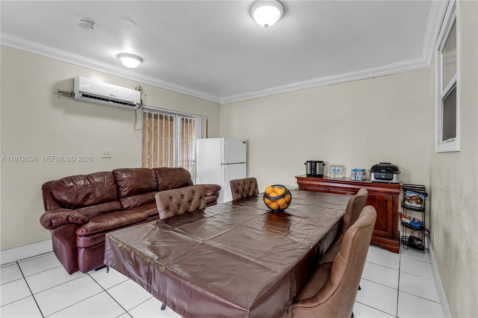 18820 Southwest 316th Street Homestead, FL 33030 - Photo 16 of 43 a living room with furniture and a couch