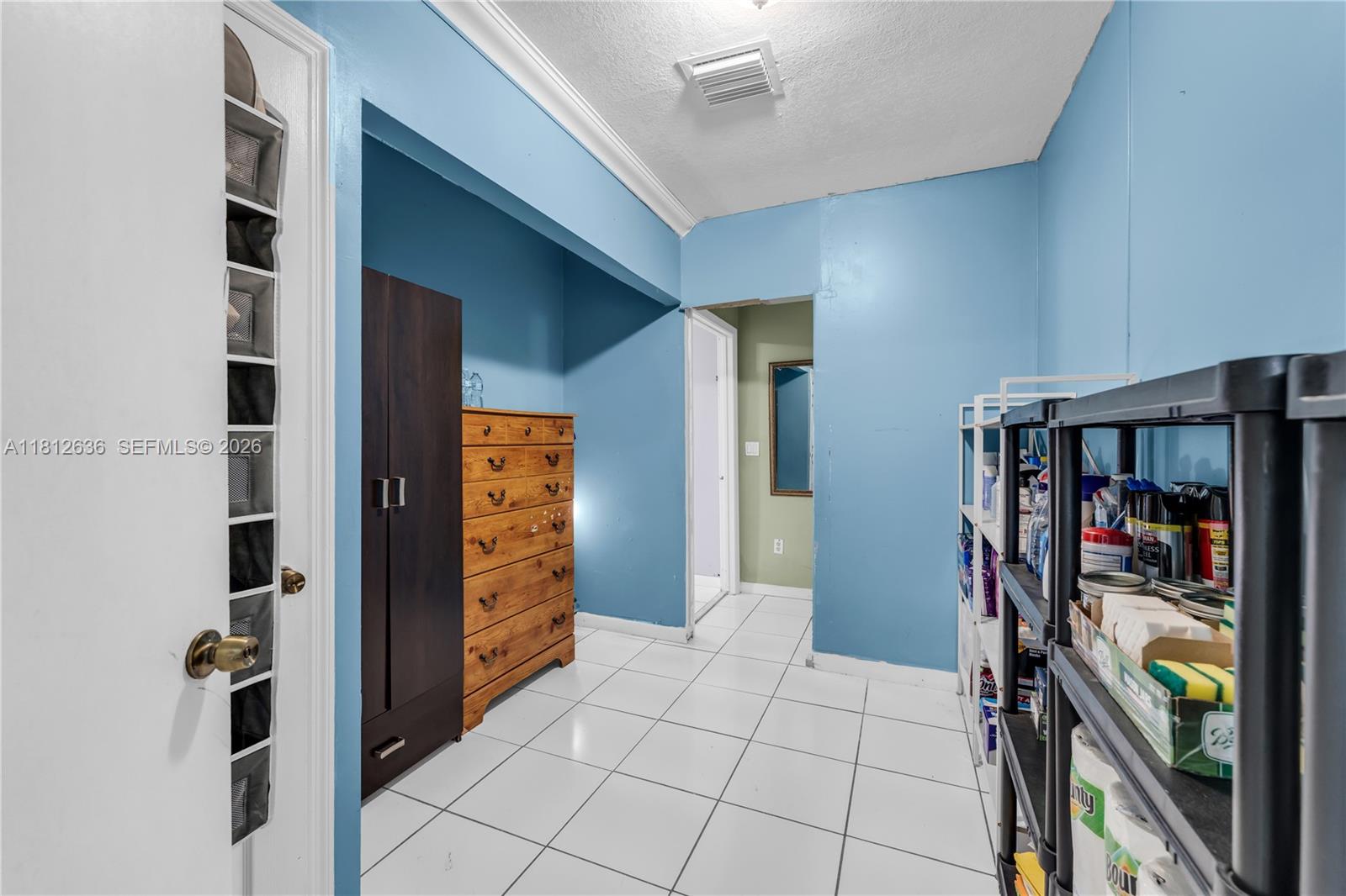 18820 Southwest 316th Street Homestead, FL 33030 - Photo 17 of 43 a view of walk in closet with clothes