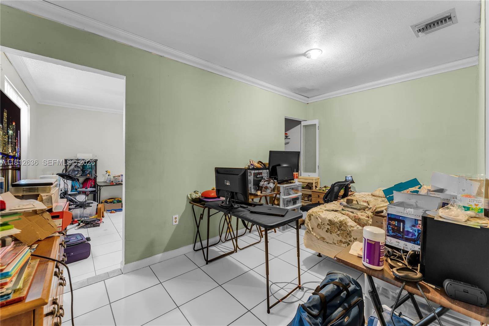 18820 Southwest 316th Street Homestead, FL 33030 - Photo 18 of 43 a view of a workspace with furniture and toys