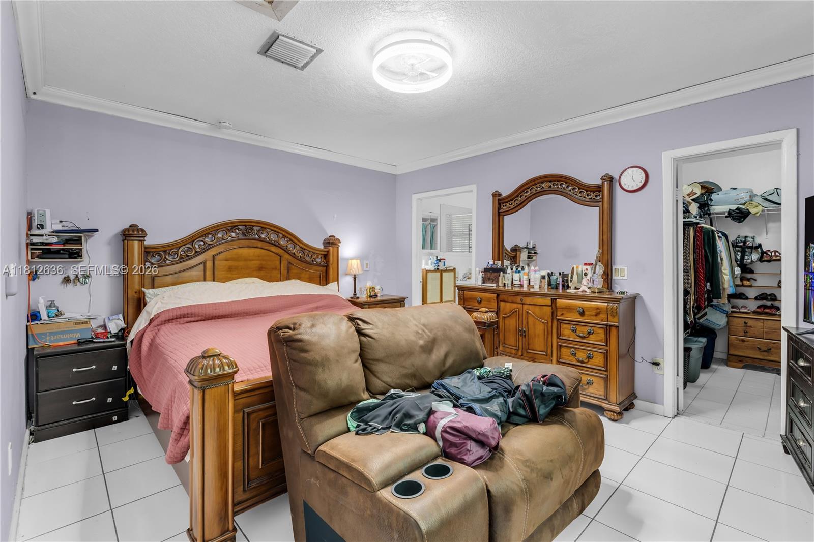 18820 Southwest 316th Street Homestead, FL 33030 - Photo 19 of 43 a bedroom with bed and window