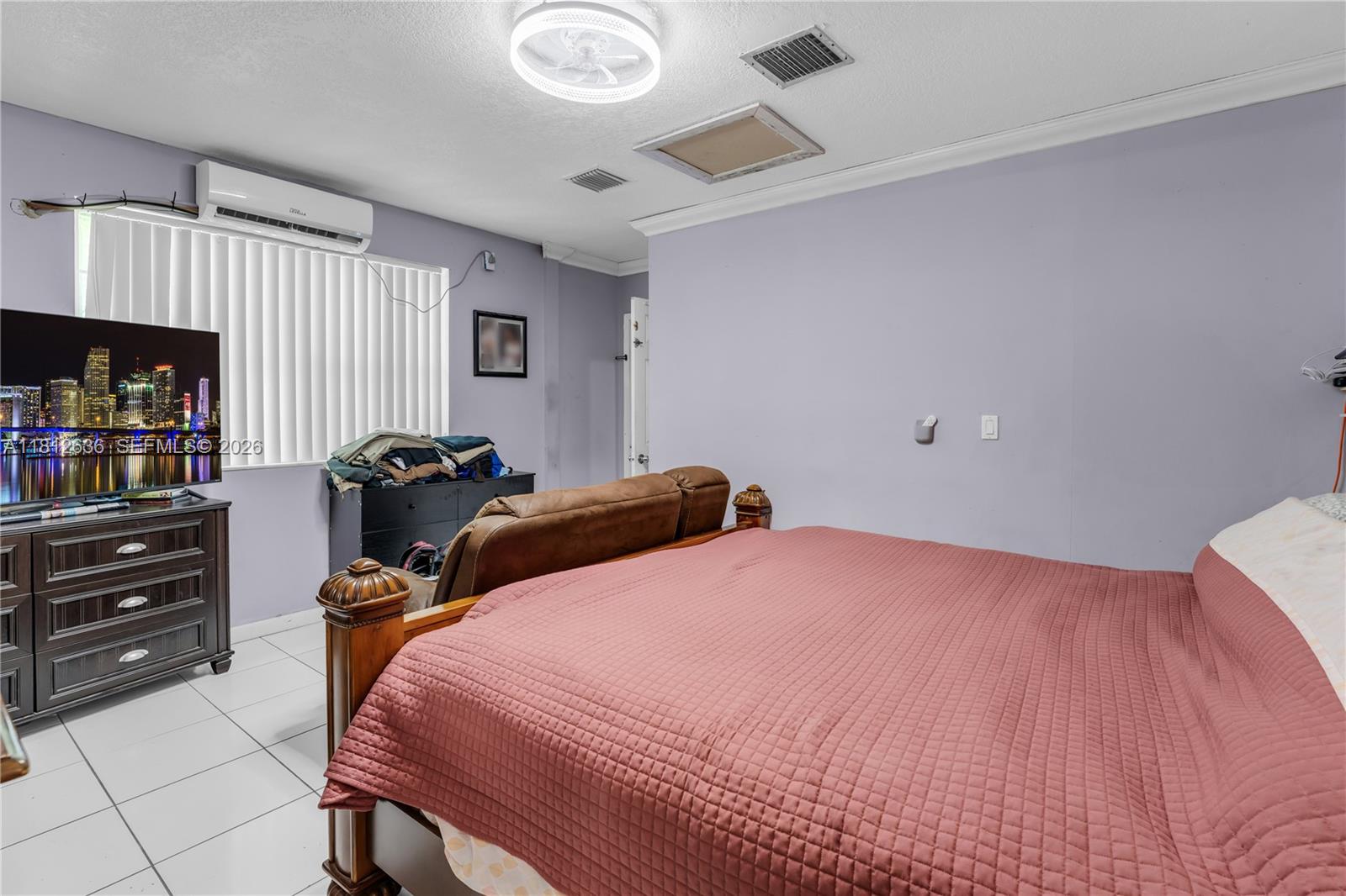 18820 Southwest 316th Street Homestead, FL 33030 - Photo 20 of 43 a bed room with a bed and a book shelf