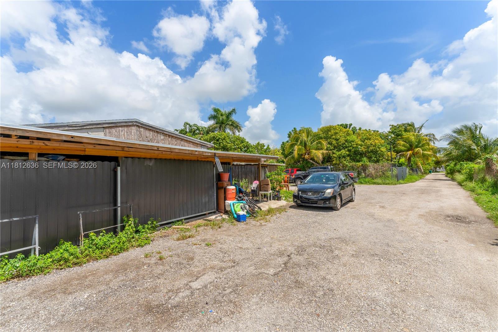 18820 Southwest 316th Street Homestead, FL 33030 - Photo 21 of 43 a view of a car in front of a building