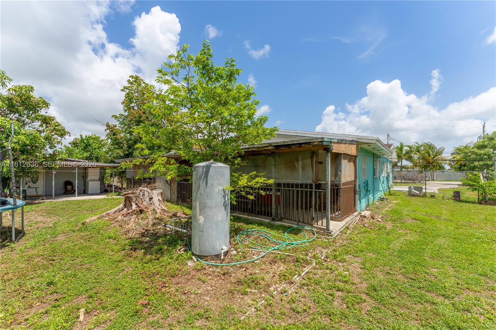 18820 Southwest 316th Street Homestead, FL 33030 - Photo 29 of 43 a house view with a garden space