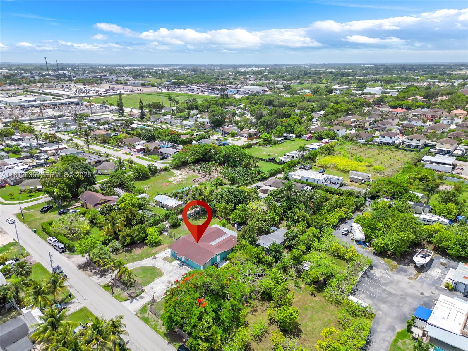 18820 Southwest 316th Street Homestead, FL 33030 - Photo 32 of 43 an aerial view of residential houses with outdoor space and trees