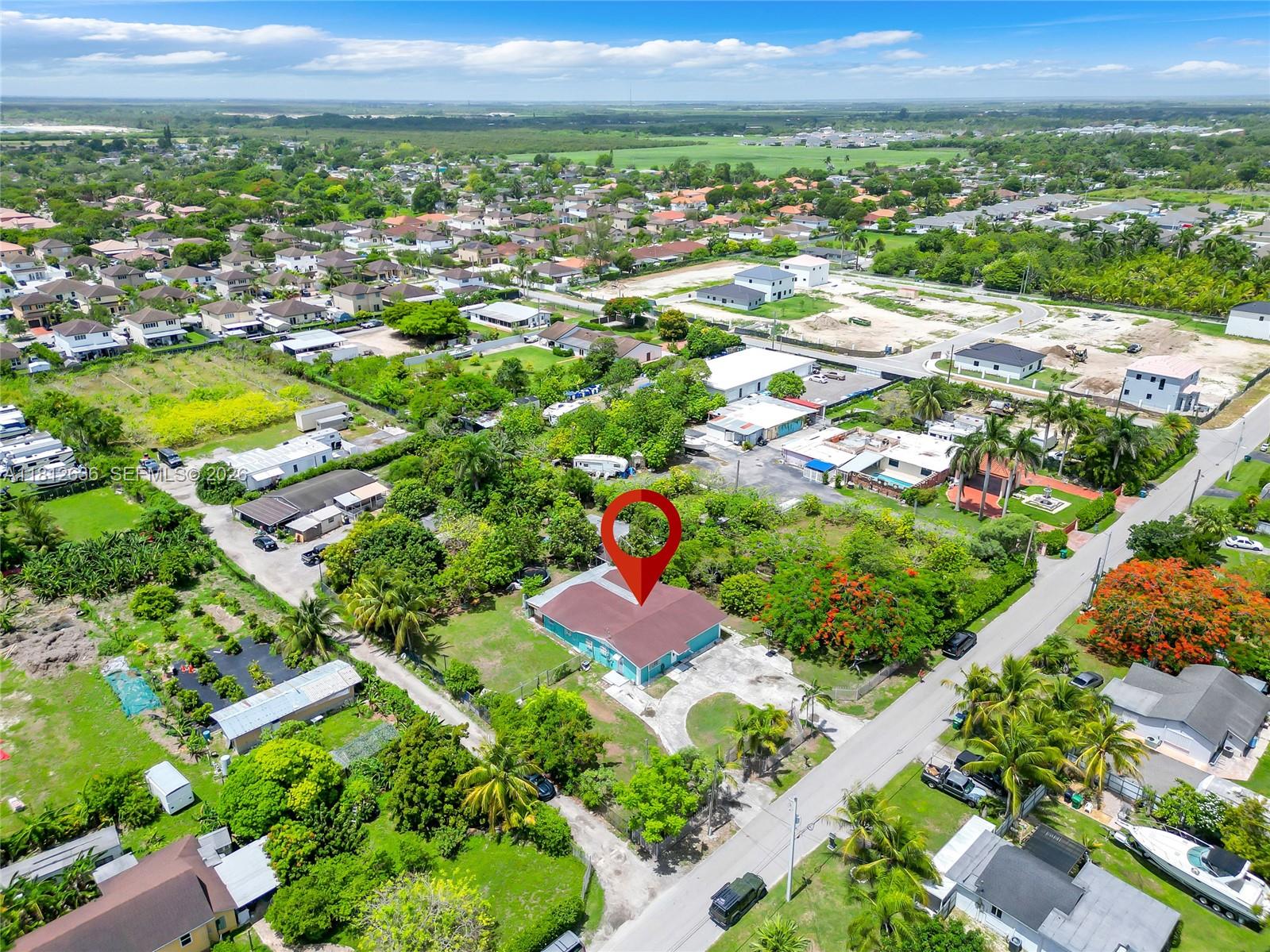 18820 Southwest 316th Street Homestead, FL 33030 - Photo 35 of 43 an aerial view of residential houses with outdoor space and trees