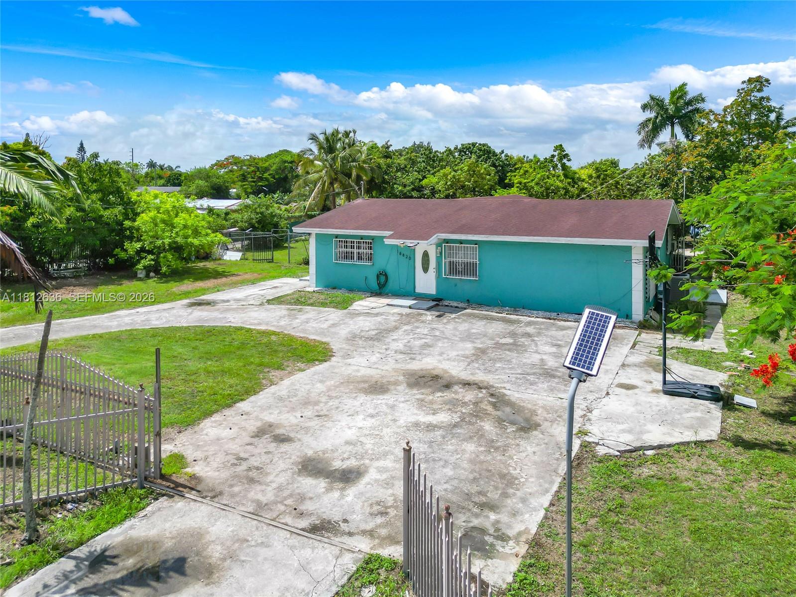 18820 Southwest 316th Street Homestead, FL 33030 - Photo 43 of 43 a view of a backyard with a garden and plants