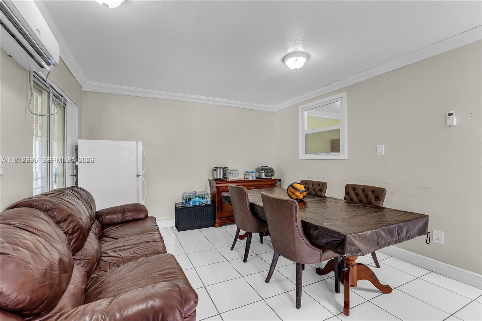 18820 Southwest 316th Street Homestead, FL 33030 - Photo 8 of 43 a view of a livingroom with furniture and dining table