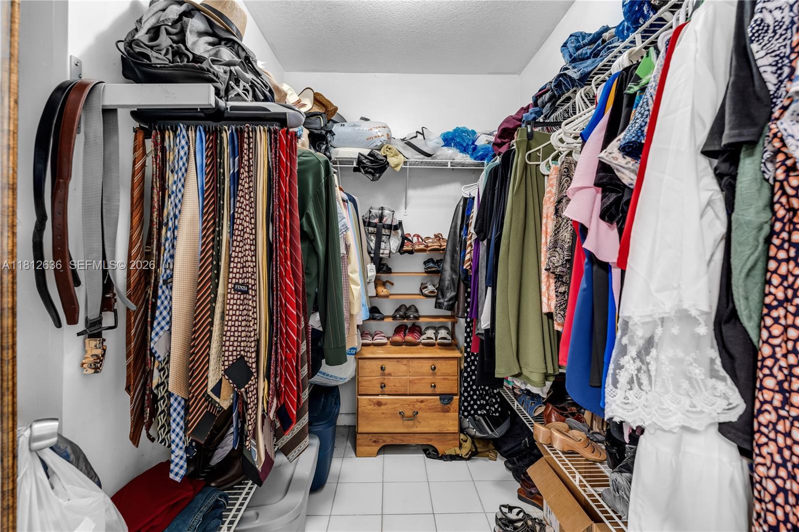 18820 Southwest 316th Street Homestead, FL 33030 - Photo 9 of 43 a view of walk in closet with clothes