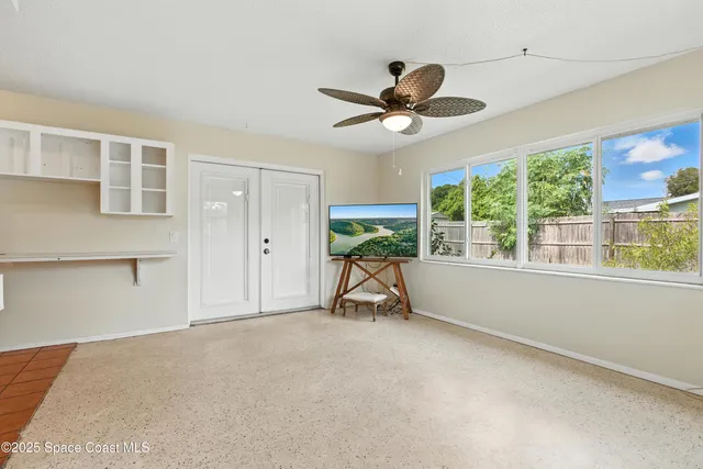 a view of an empty room with a window