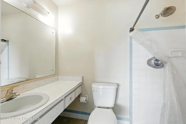 a bathroom with a sink and toilet