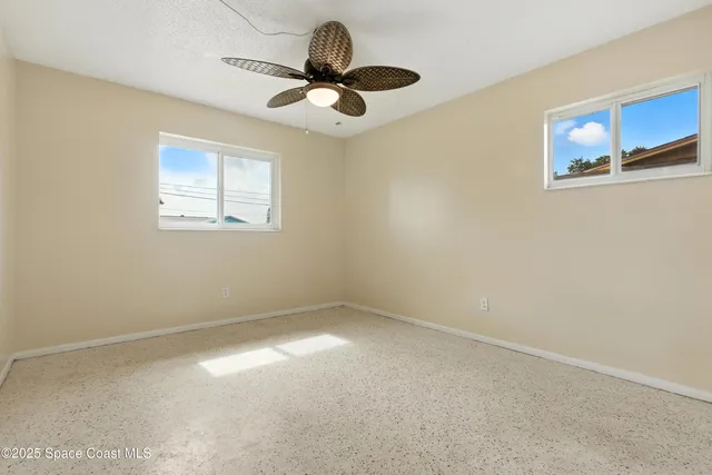 a view of a big room with windows