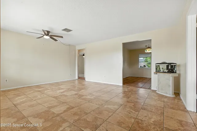 a view of a kitchen with a sink and cabinets