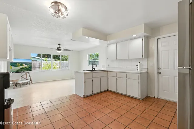a kitchen with a cabinets and window