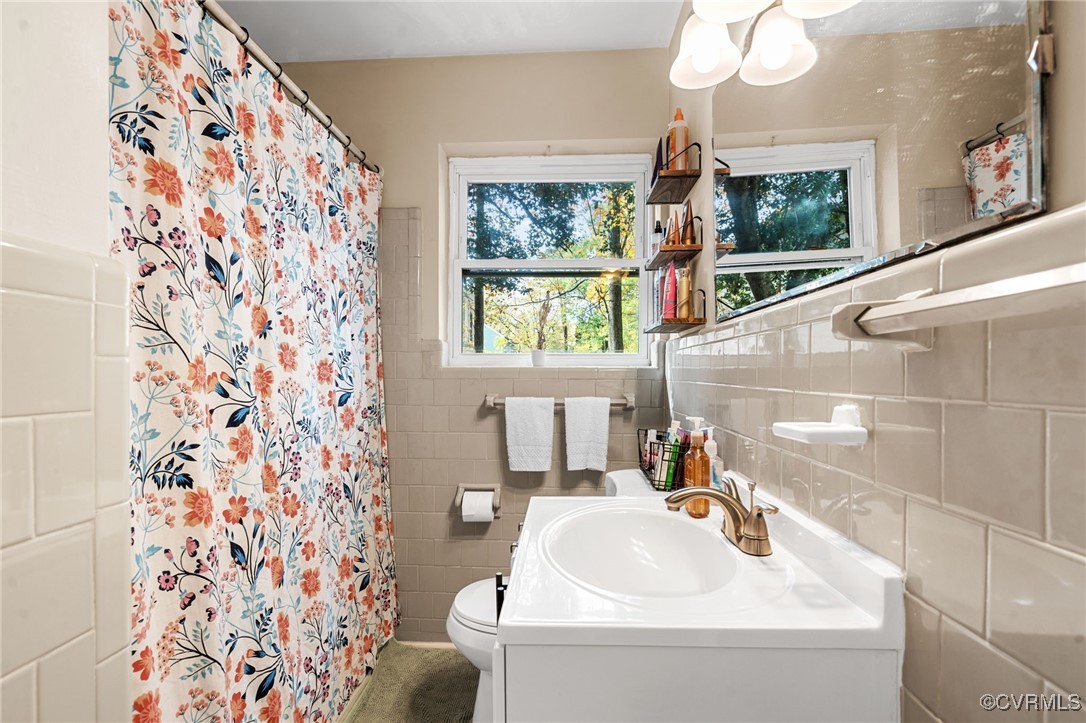2308 Adelphi Road Henrico, VA 23229 - Photo 11 of 19 Bathroom featuring tile walls, vanity, toilet, and