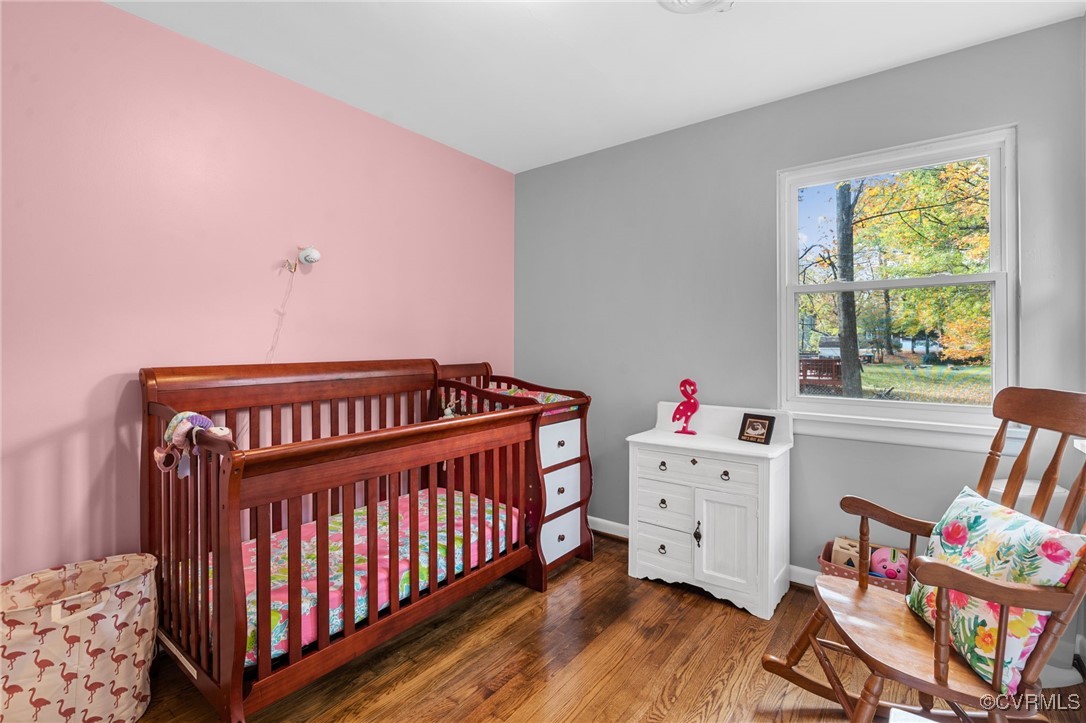 2308 Adelphi Road Henrico, VA 23229 - Photo 13 of 19 Bedroom with a nursery area and dark hardwood / wo