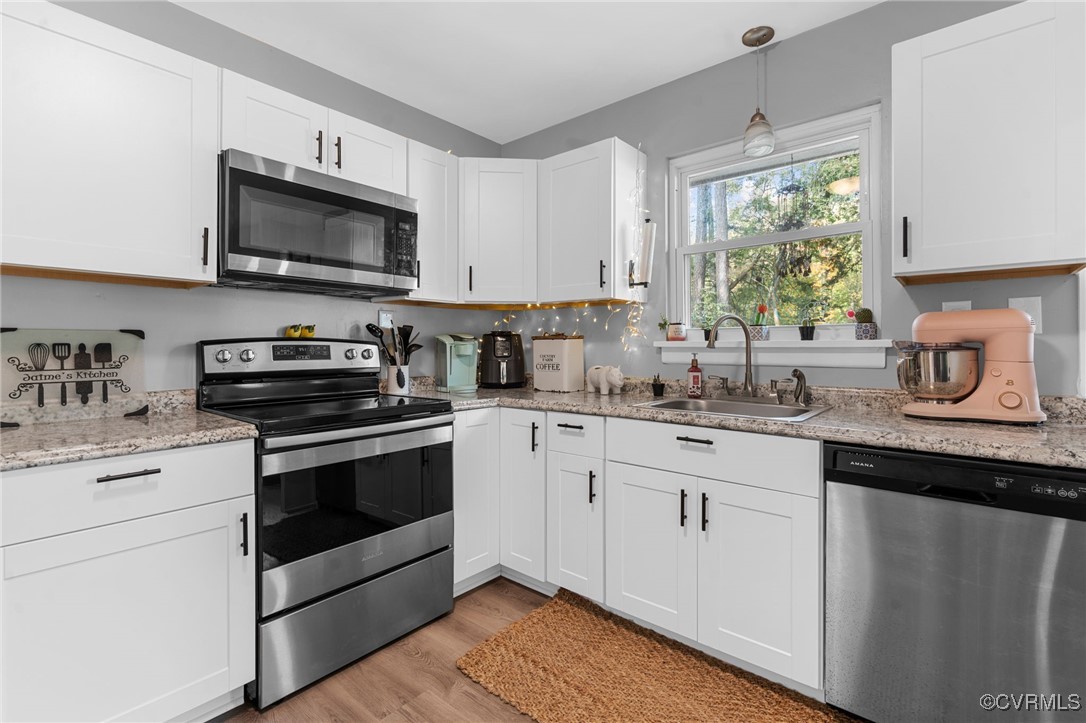 2308 Adelphi Road Henrico, VA 23229 - Photo 6 of 19 Kitchen with sink, light stone counters, appliance