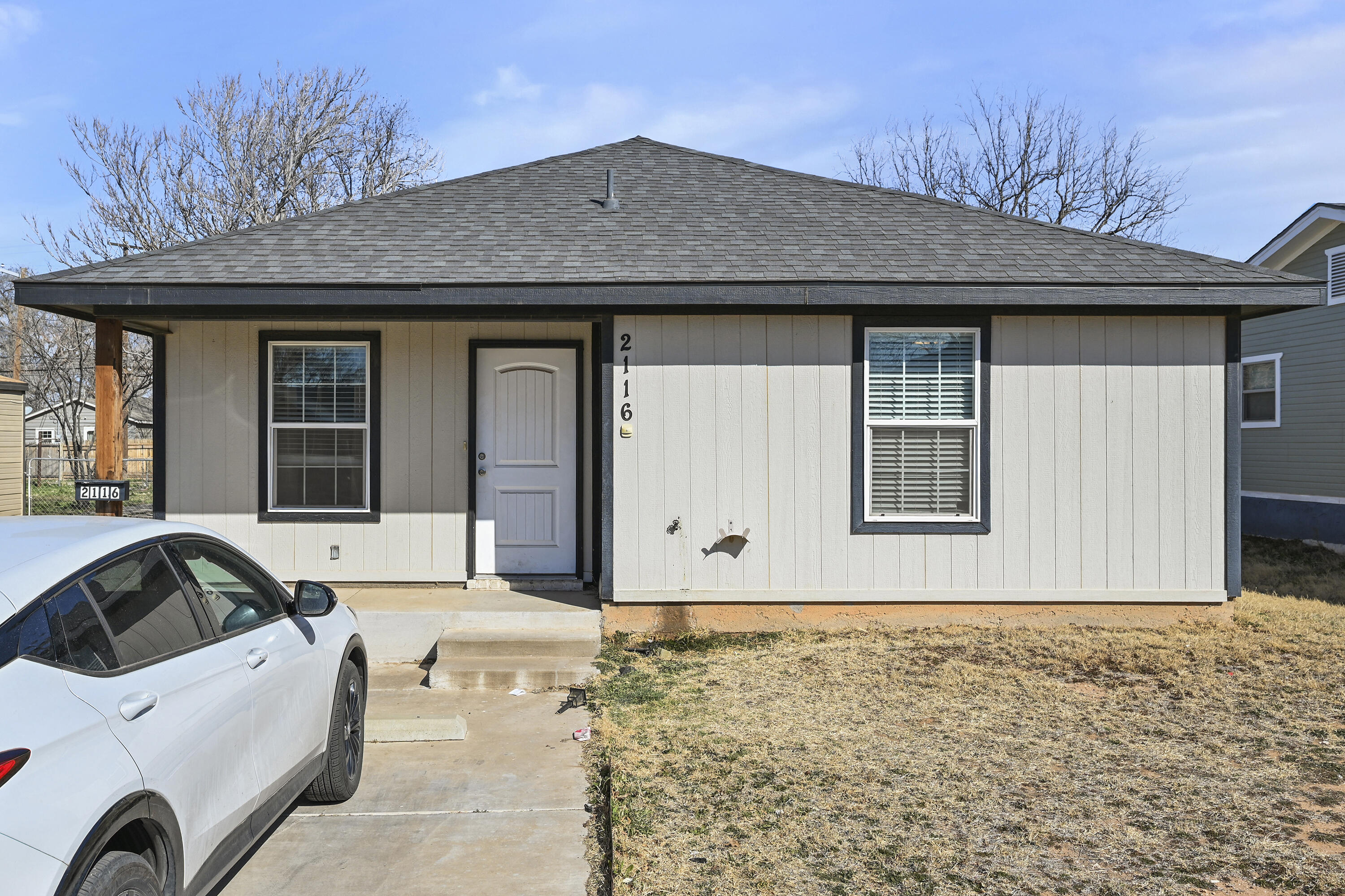 a front view of a house with a yard