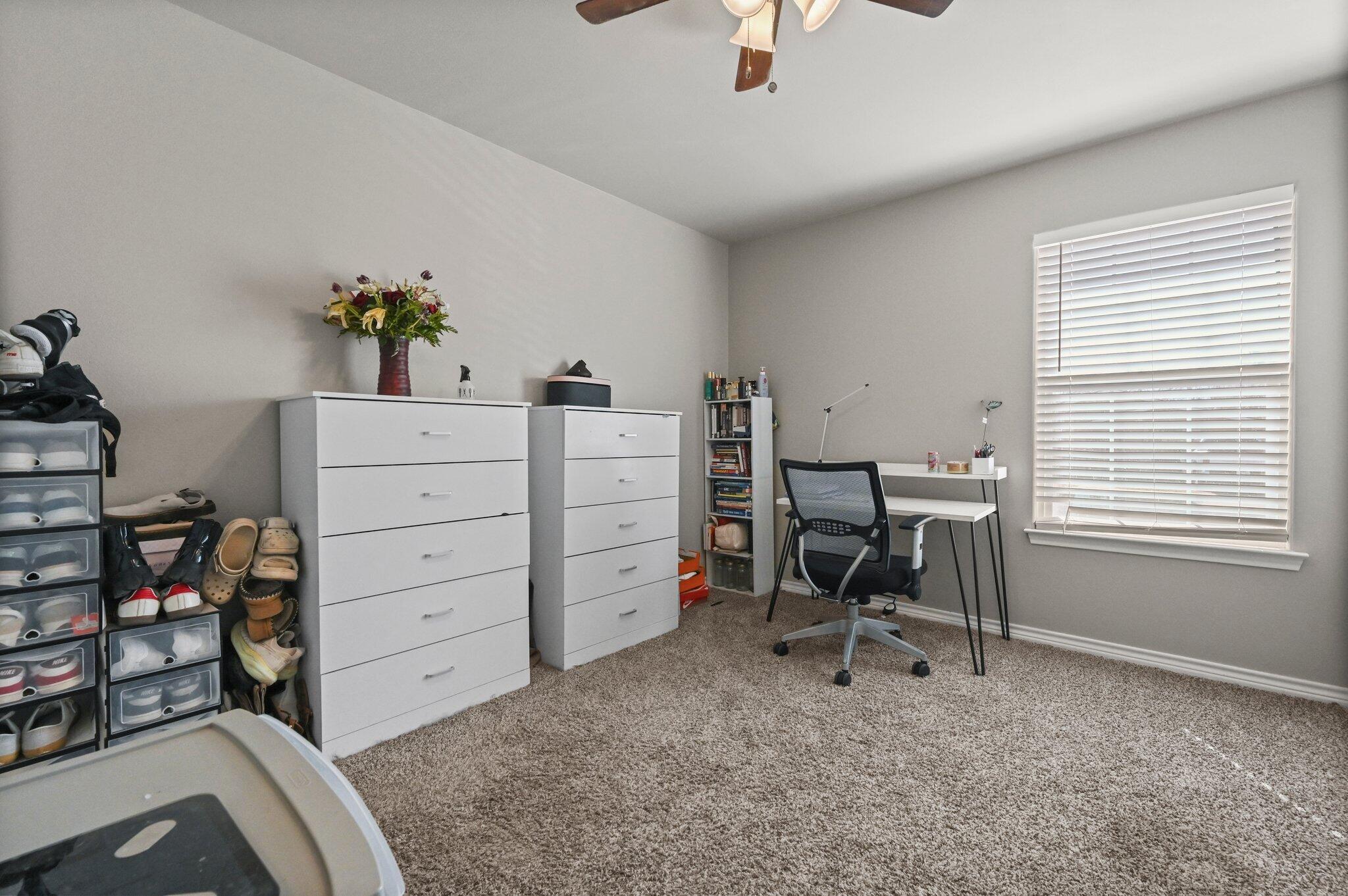 2116 24th Street, Unit 1 Lubbock, TX 79411 - Photo 11 of 13 a view of a workspace with furniture